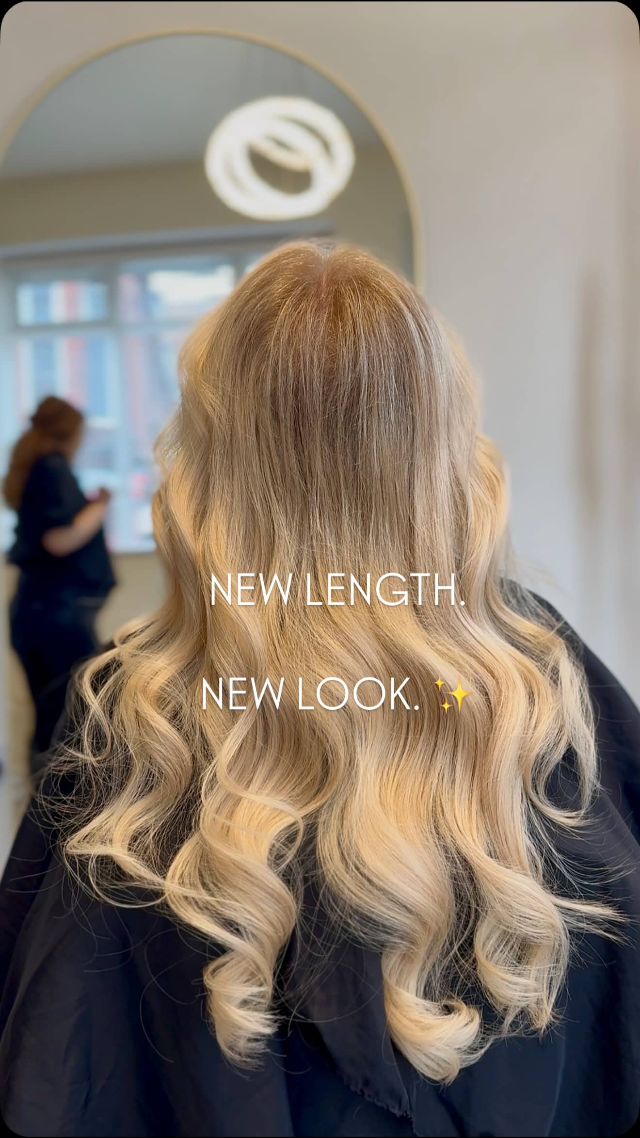 Back view of long wavy lived-in blonde hair extensions by Greta